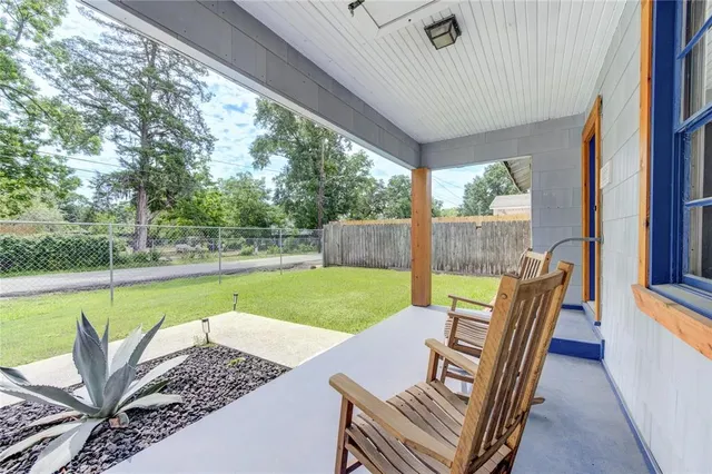 a view of a patio with swimming pool