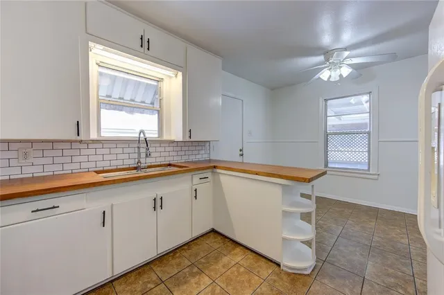 a bathroom with a sink a vanity and mirror