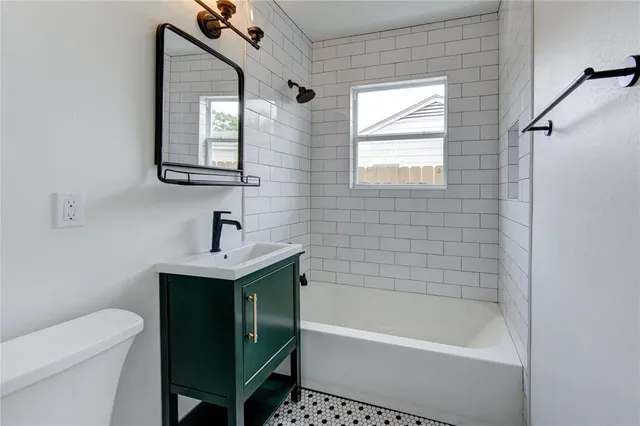 a bathroom with a sink toilet and bathtub