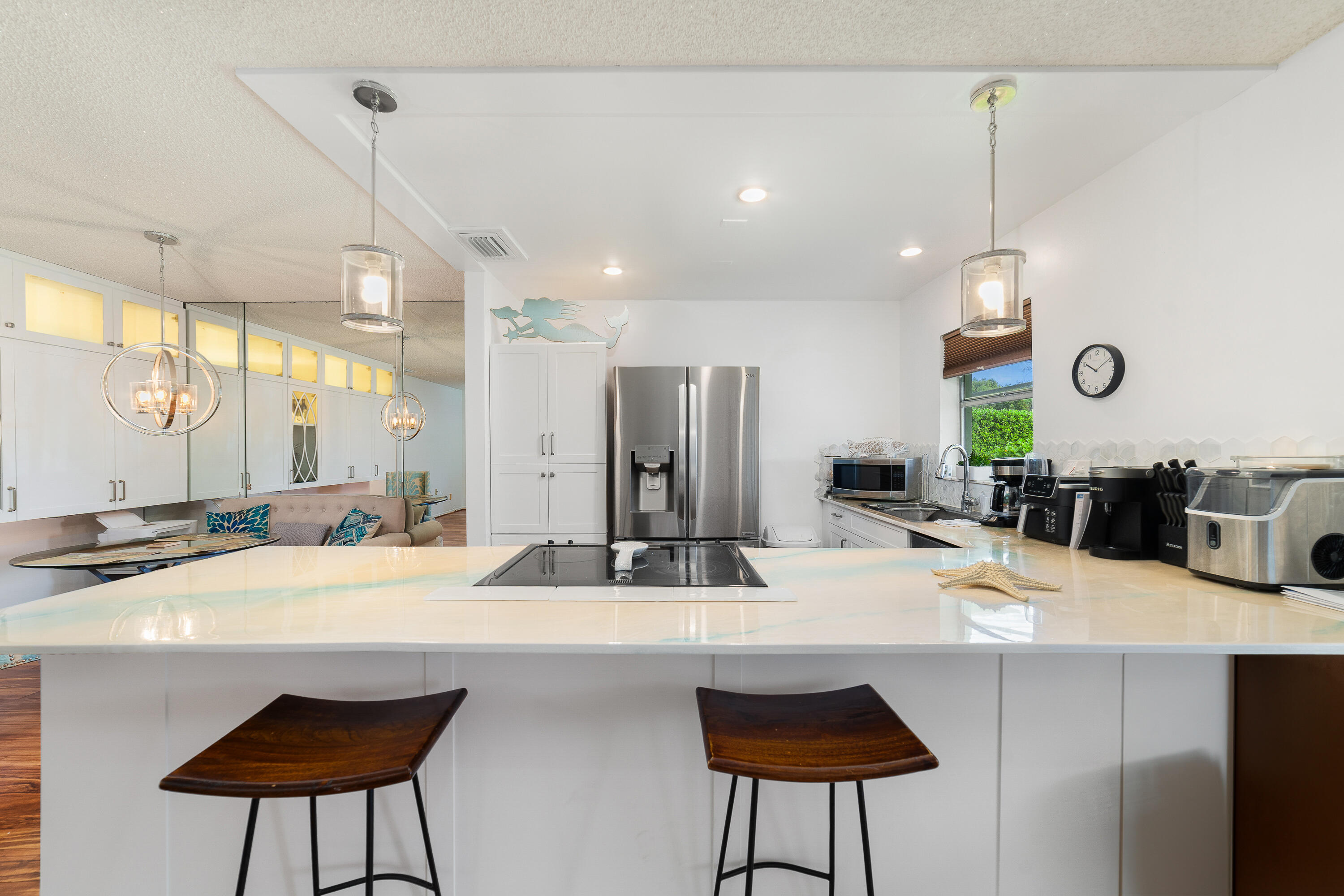 3331 Valley Road, Unit C Boynton Beach, FL 33435 - Photo 11 of 28 a kitchen with kitchen island a sink and a refrigerator
