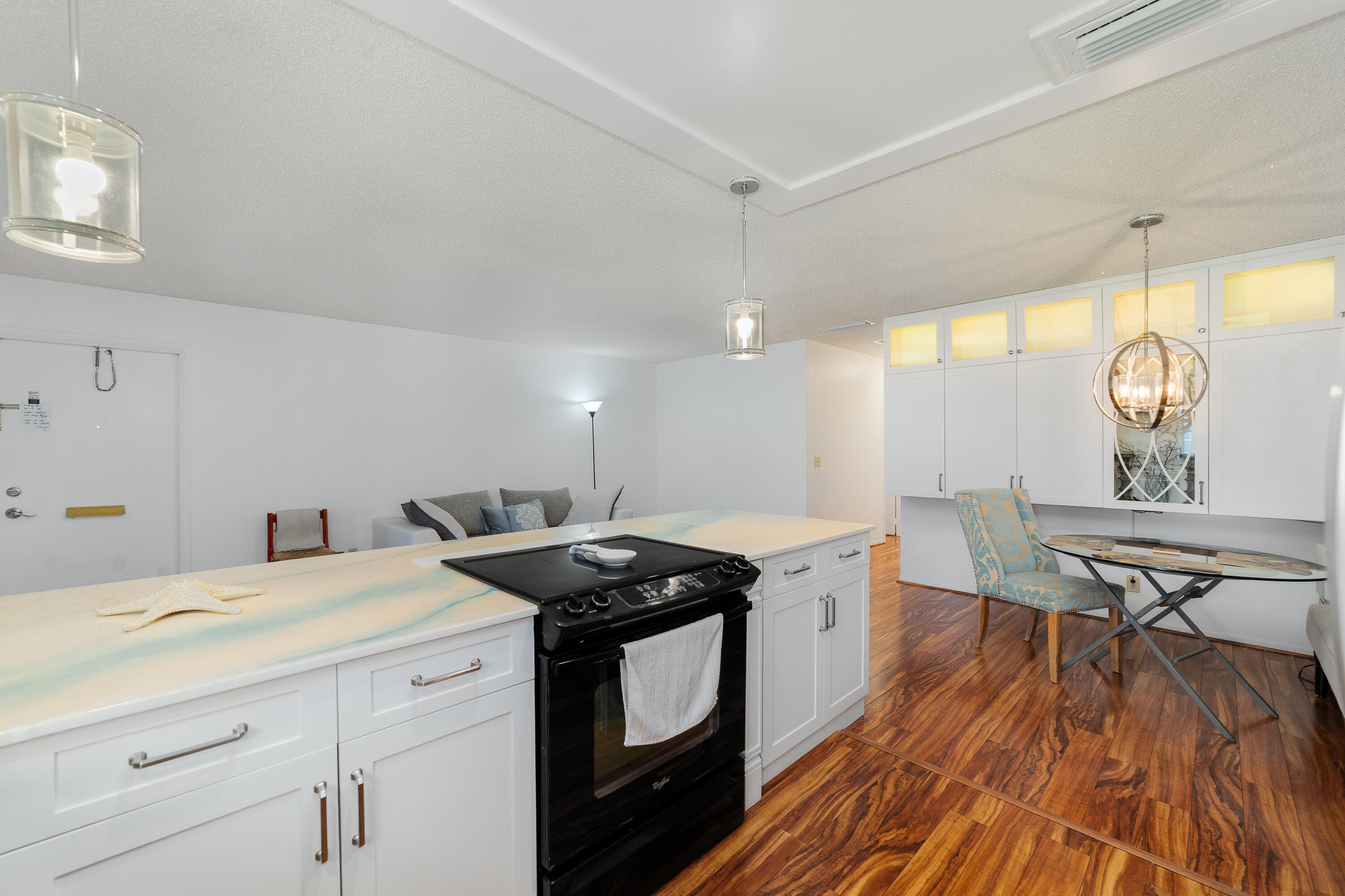 3331 Valley Road, Unit C Boynton Beach, FL 33435 - Photo 12 of 28 a kitchen with a sink a stove and cabinets