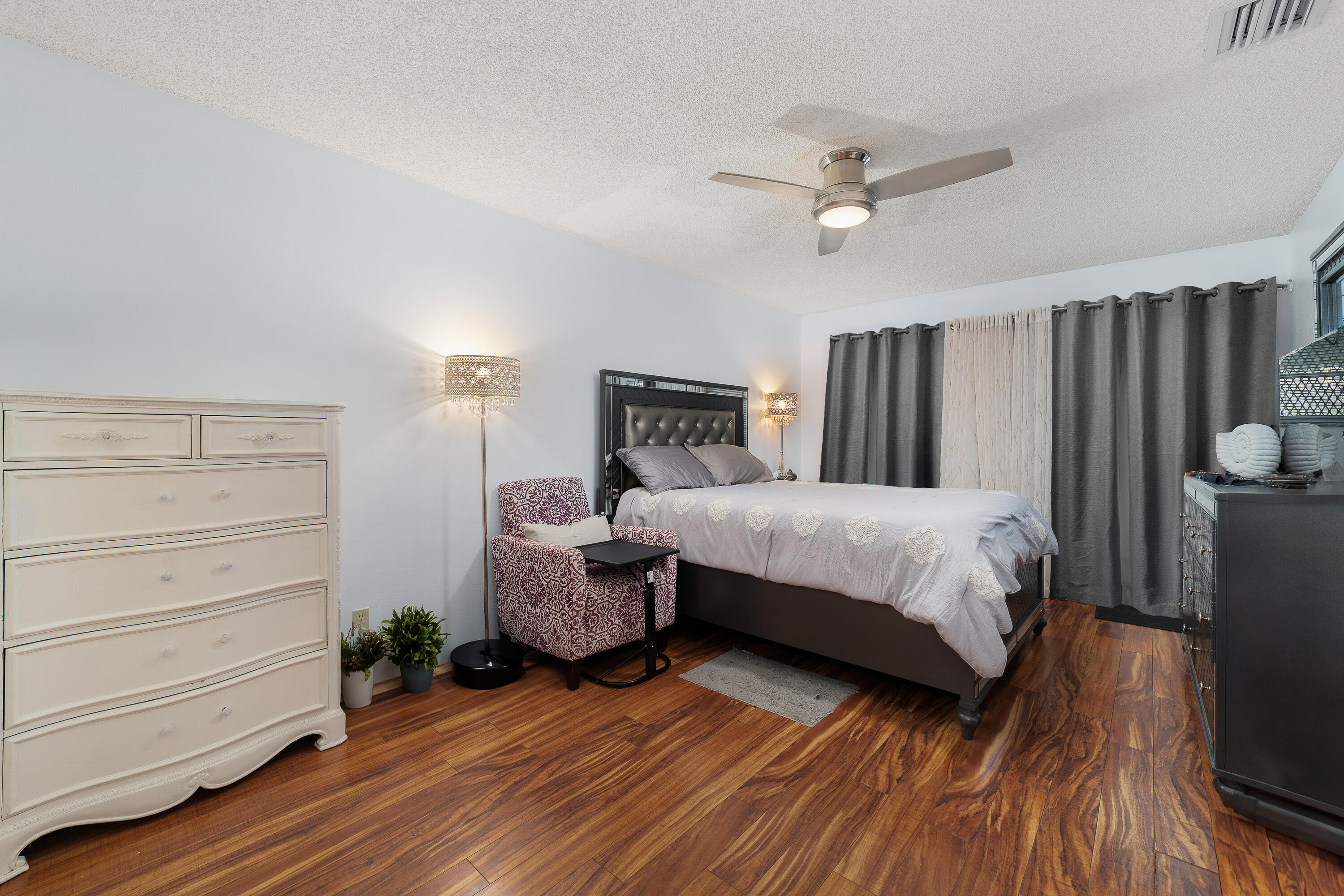 3331 Valley Road, Unit C Boynton Beach, FL 33435 - Photo 14 of 28 a bed room with a bed and a ceiling fan