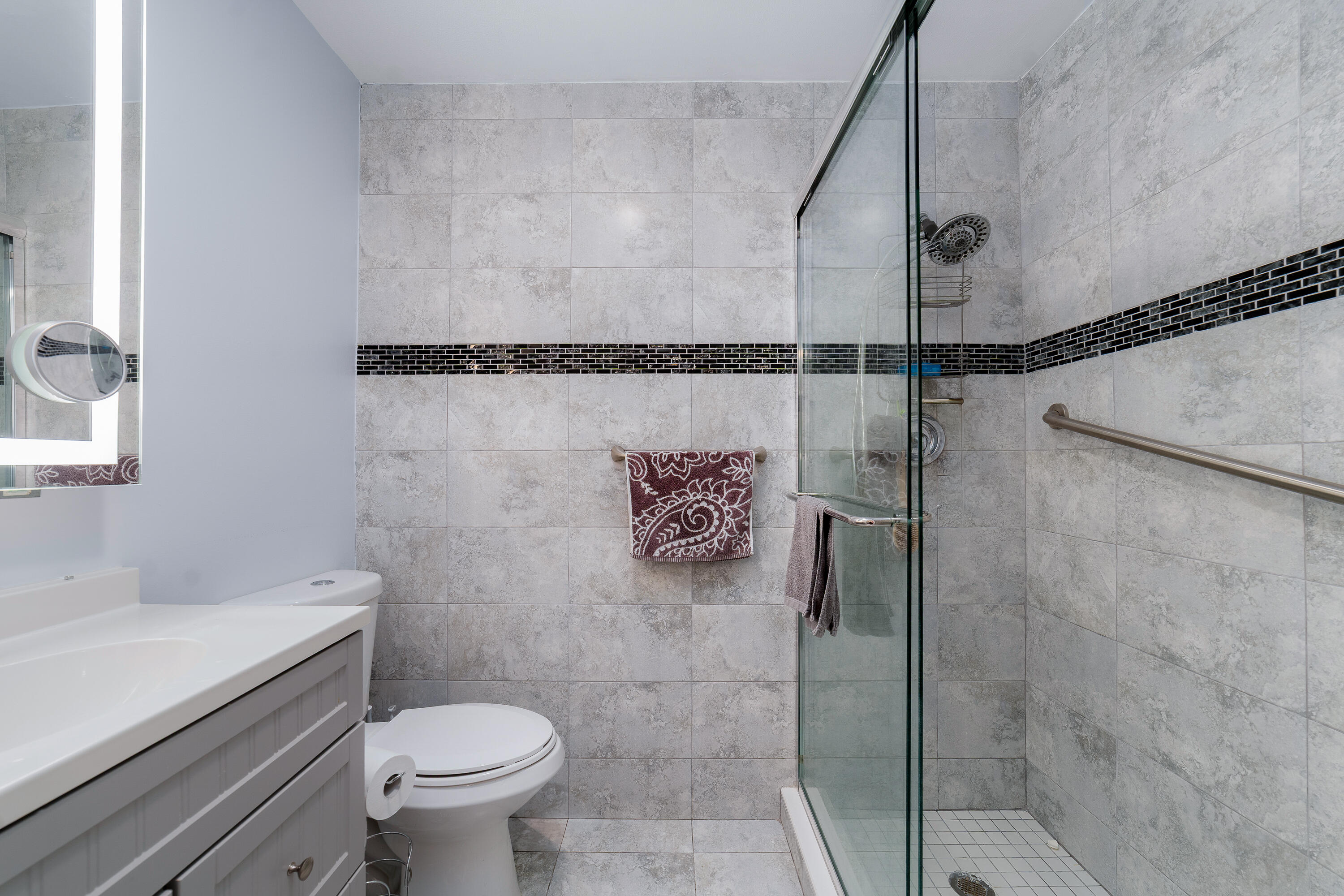 3331 Valley Road, Unit C Boynton Beach, FL 33435 - Photo 16 of 28 a bathroom with a toilet and a shower