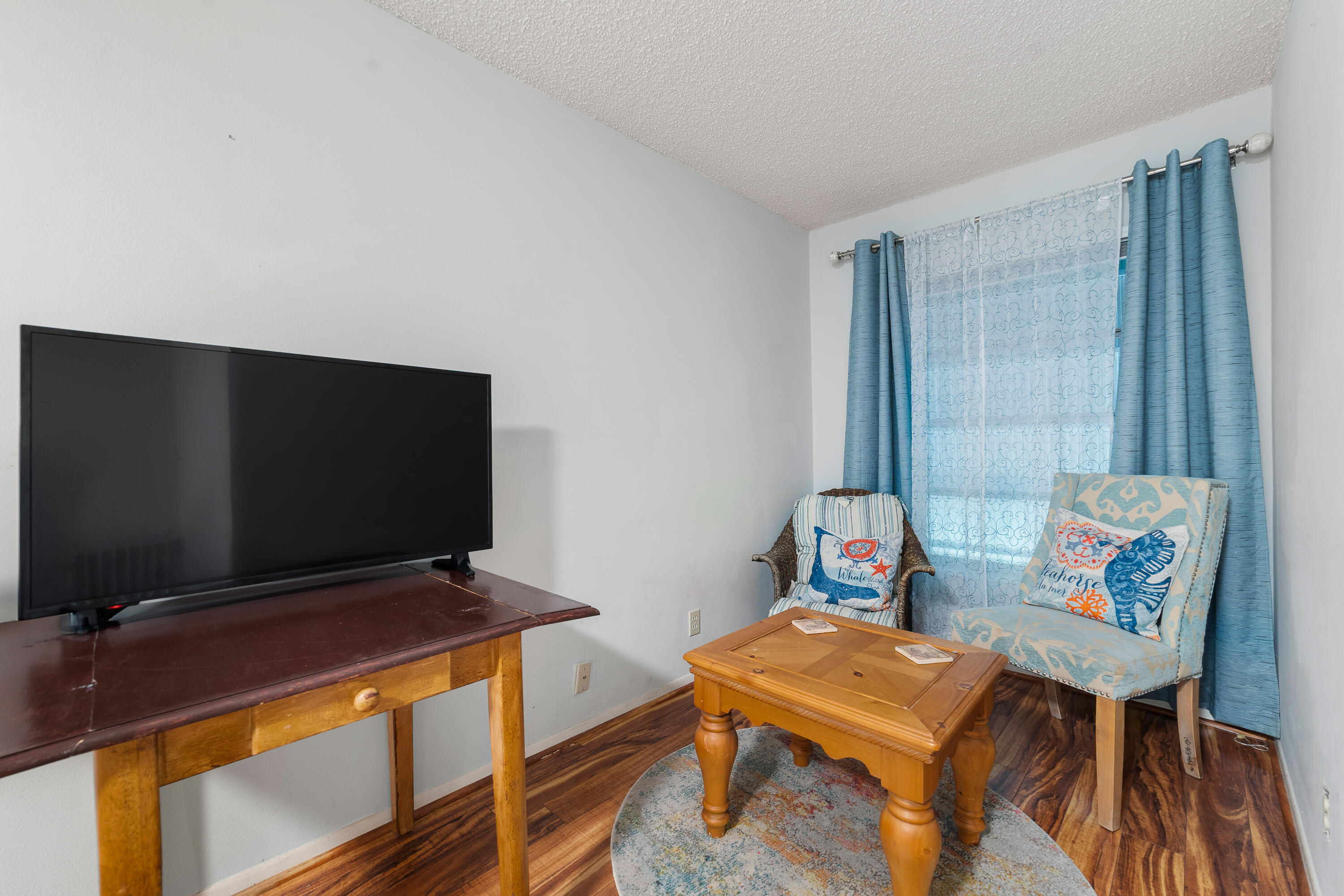 3331 Valley Road, Unit C Boynton Beach, FL 33435 - Photo 18 of 28 a living room with furniture and a flat screen tv
