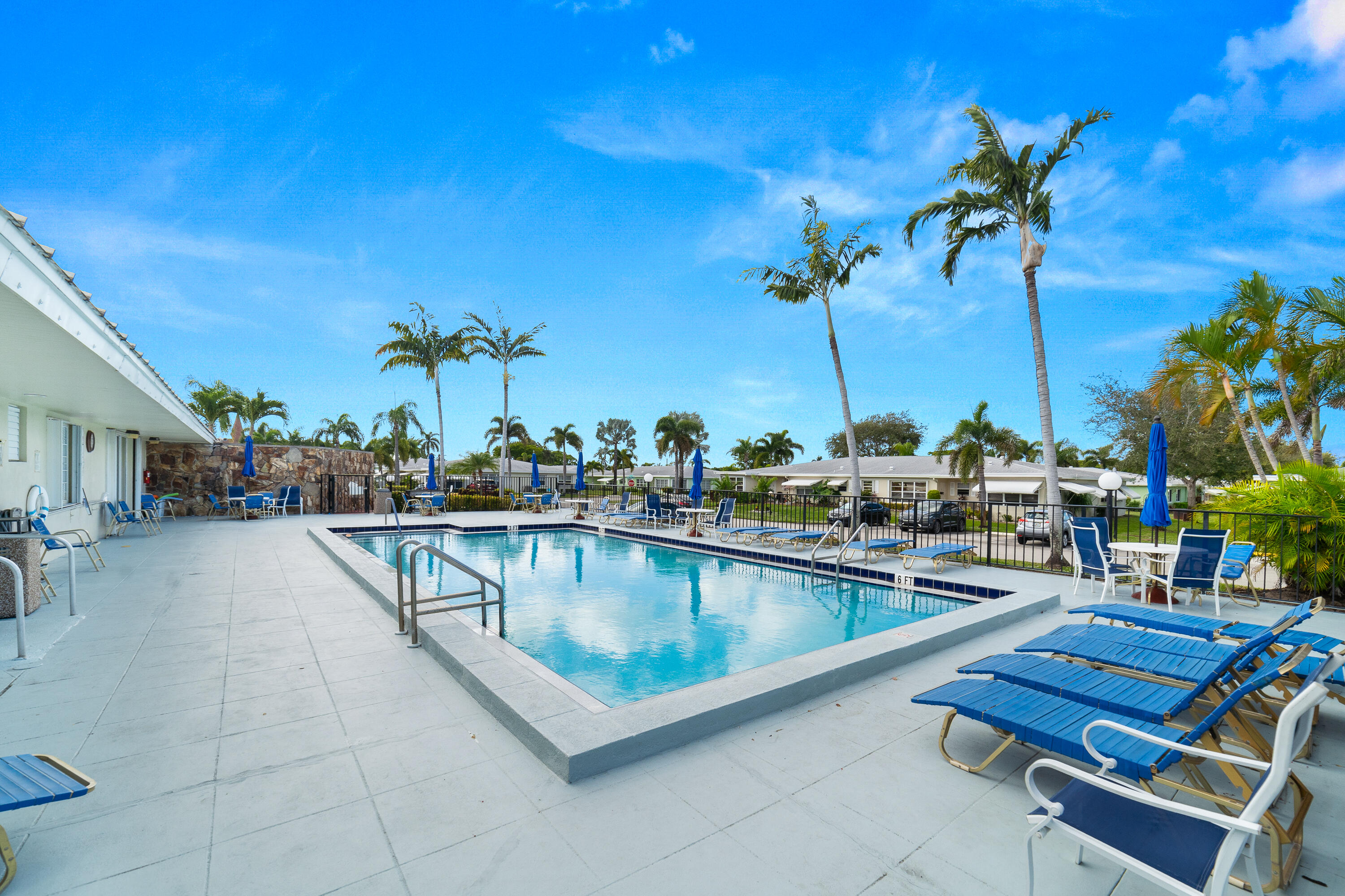 3331 Valley Road, Unit C Boynton Beach, FL 33435 - Photo 24 of 28 a view of a swimming pool with outdoor seating