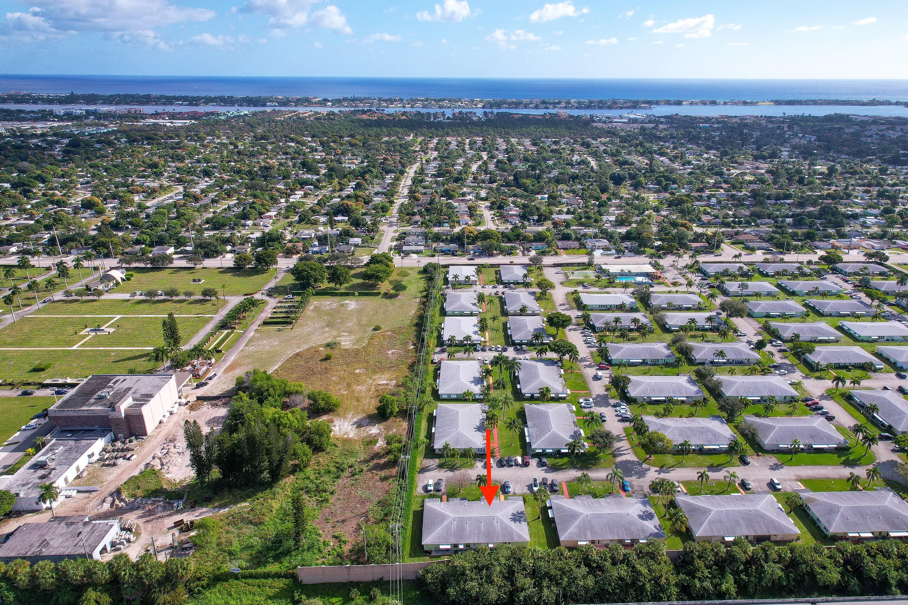 3331 Valley Road, Unit C Boynton Beach, FL 33435 - Photo 26 of 28 an aerial view of residential houses with outdoor space and trees