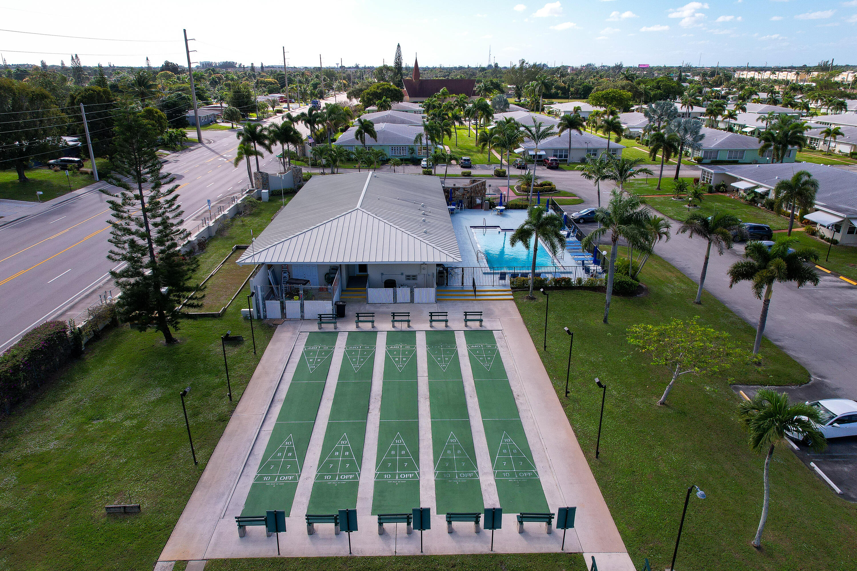 3331 Valley Road, Unit C Boynton Beach, FL 33435 - Photo 28 of 28 a view of yard with swimming pool and outdoor seating