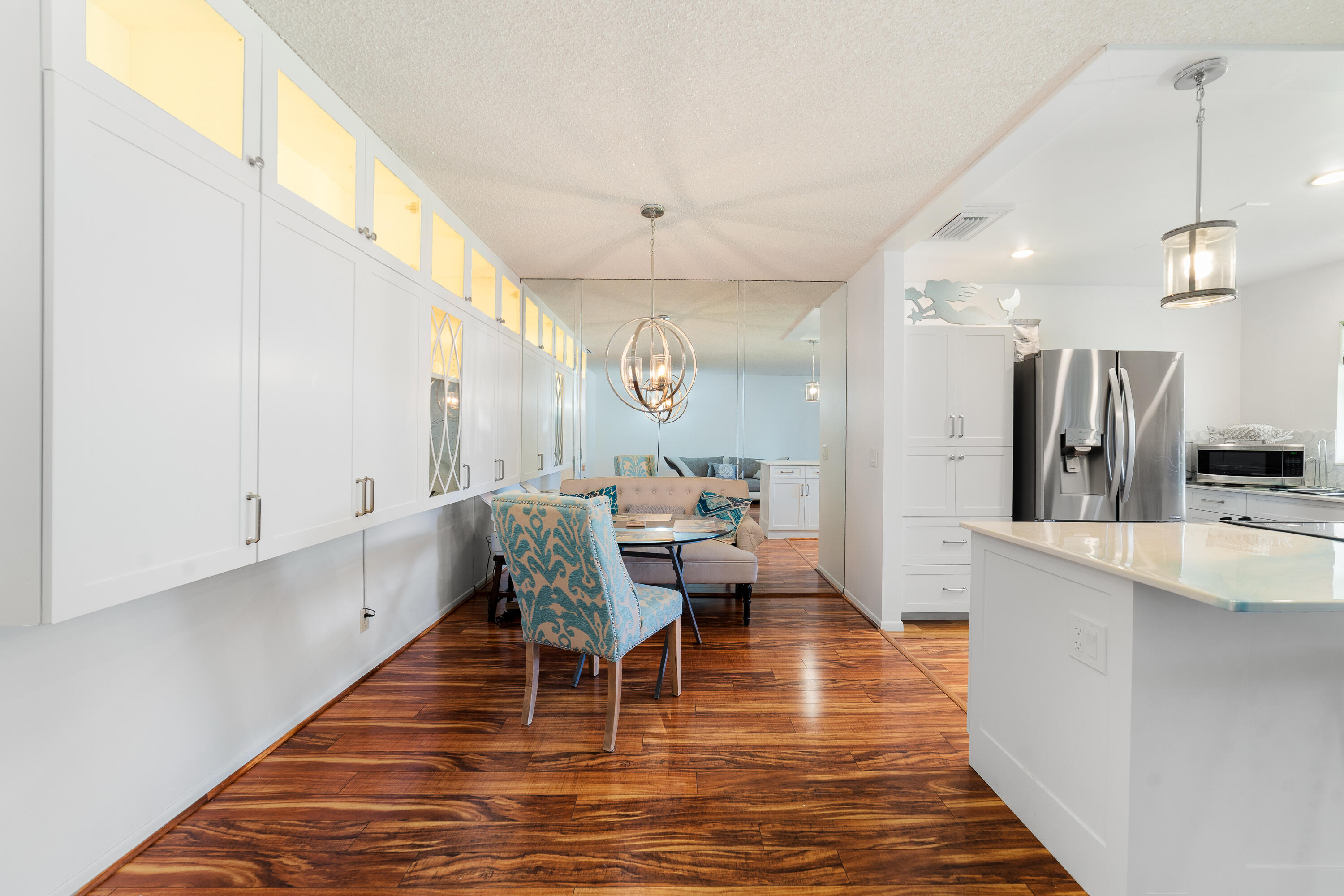 3331 Valley Road, Unit C Boynton Beach, FL 33435 - Photo 7 of 28 a living room with furniture a large window and wooden floor