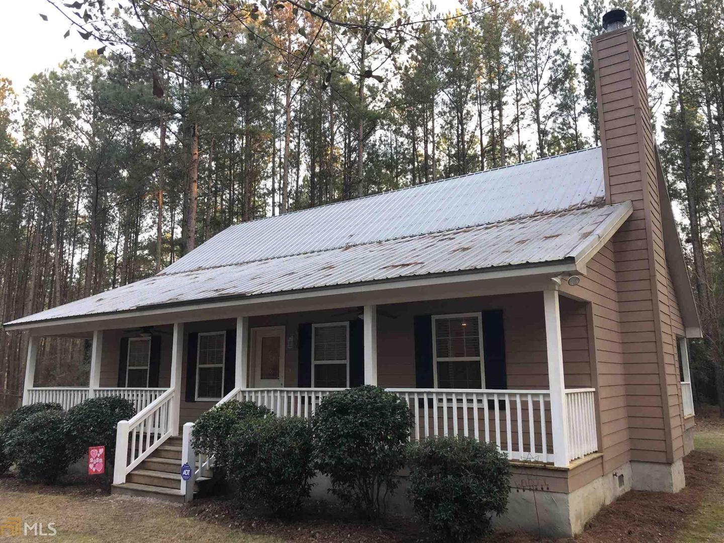 30070 Salem Church Road Metter, GA 30439 - Photo 1 of 1 a backyard of a house with seating space