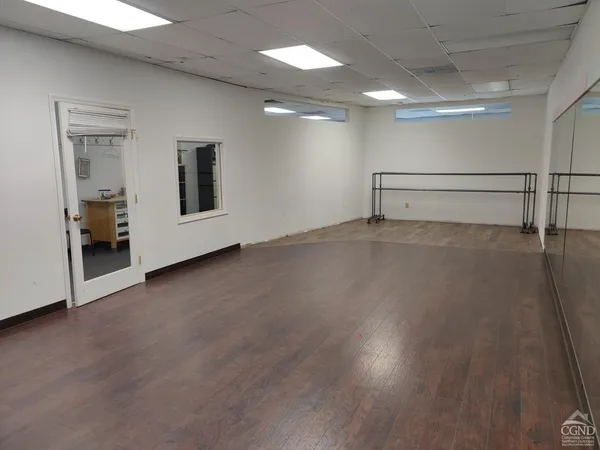 a view of a livingroom with wooden floor