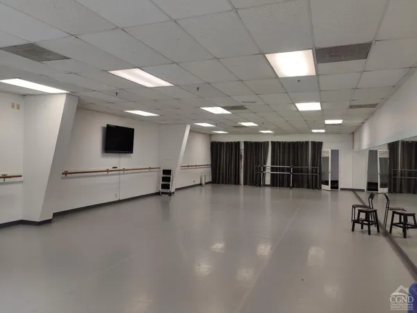 a view of a livingroom with chairs