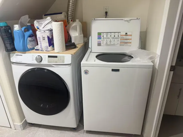 a utility room with dryer and washer