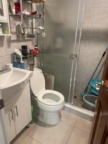 a close view of a sink and a toilet