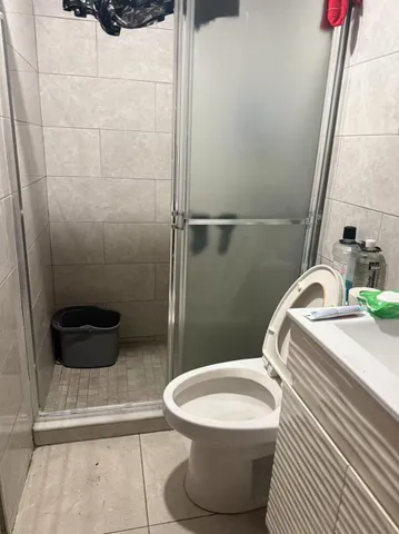 a bathroom with a toilet and a sink