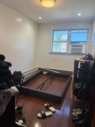 a room with furniture gym equipment and a window
