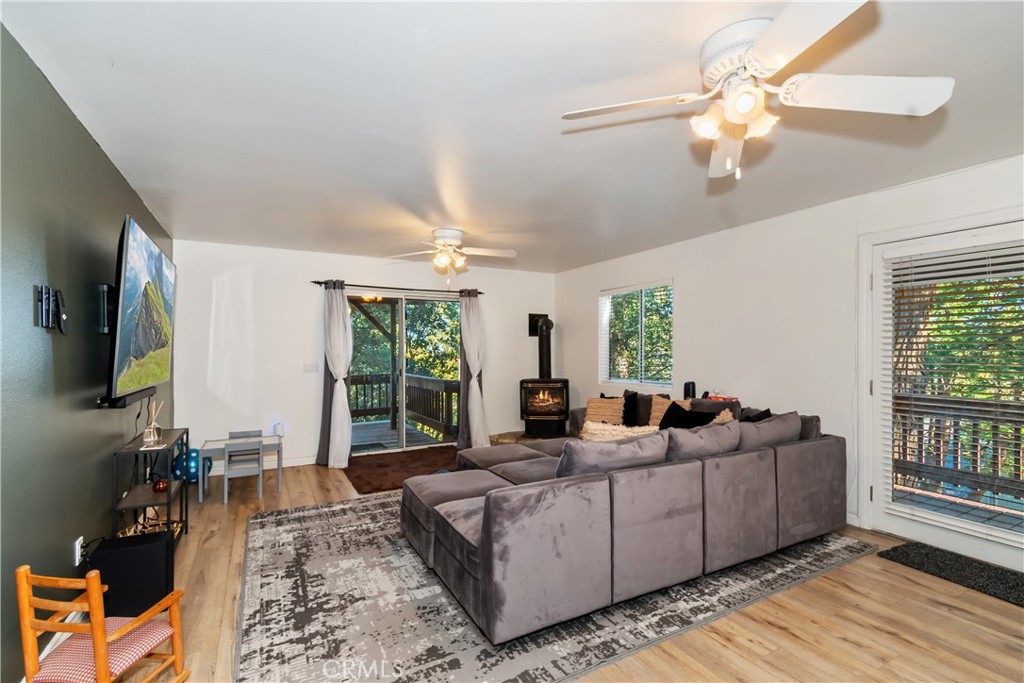 198 Pine Ridge Road Crestline, CA 92325 - Photo 14 of 45 a living room with furniture large window and flat screen tv
