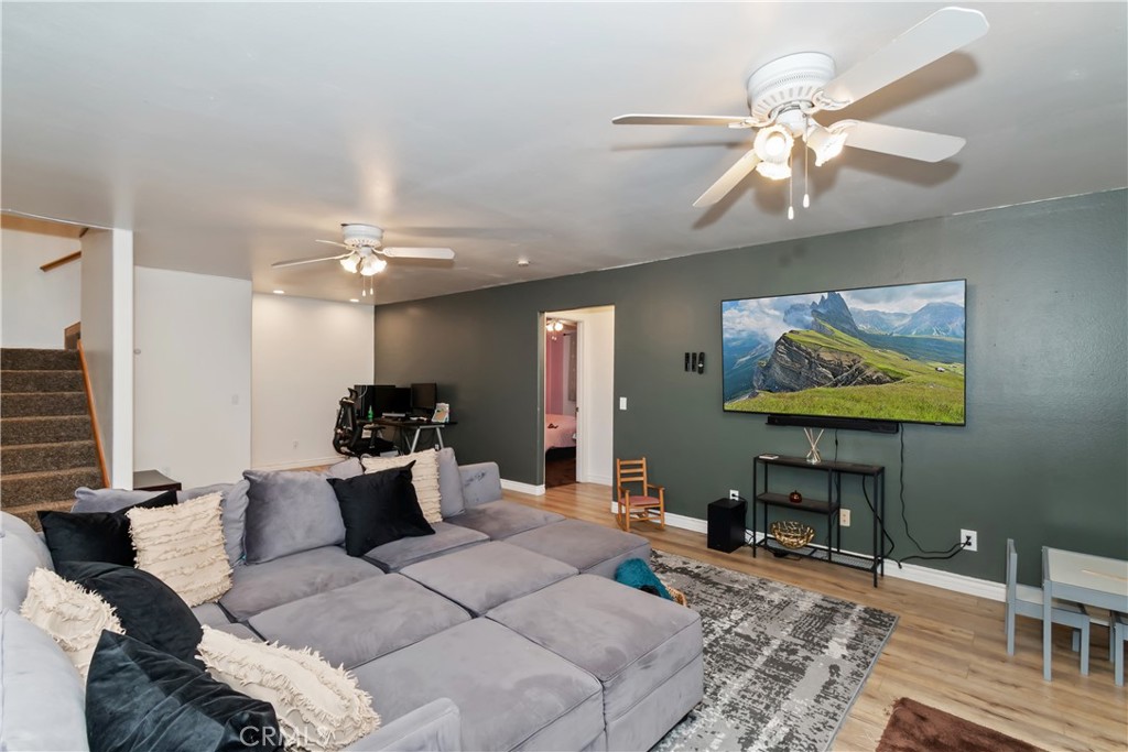 198 Pine Ridge Road Crestline, CA 92325 - Photo 17 of 45 a living room with furniture and a flat screen tv