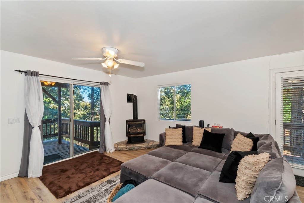 198 Pine Ridge Road Crestline, CA 92325 - Photo 18 of 45 a living room with furniture and a large window