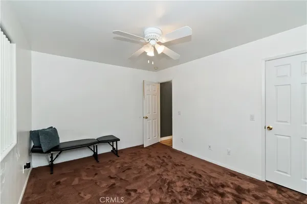 a bedroom with a workspace