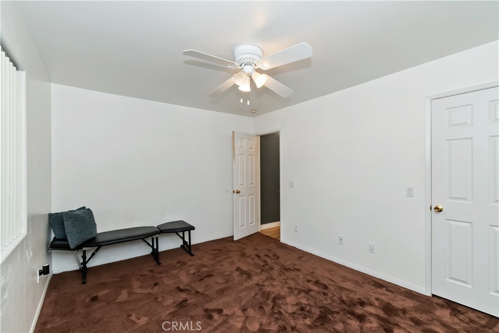 198 Pine Ridge Road Crestline, CA 92325 - Photo 23 of 45 a bedroom with a workspace