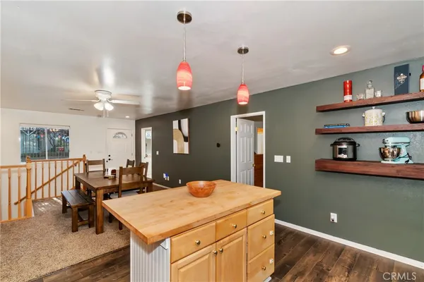 a kitchen that has a table and chairs in it