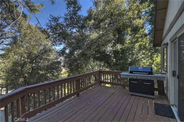 a view of a balcony with wooden floor