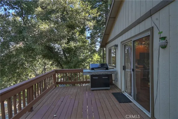 a view of balcony with wooden floor