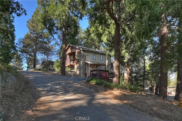 a view of a house with a tree