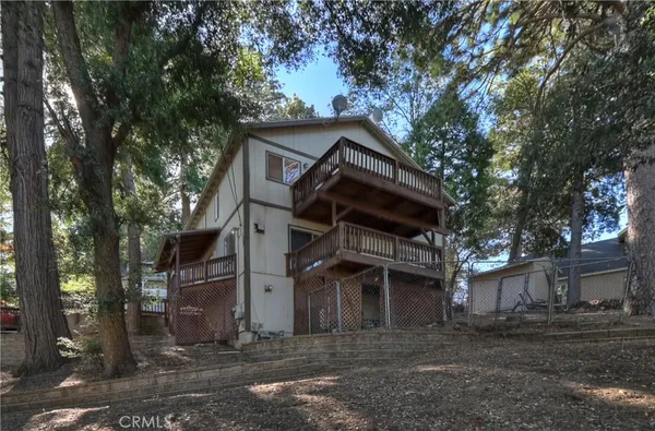 a view of a house with a tree