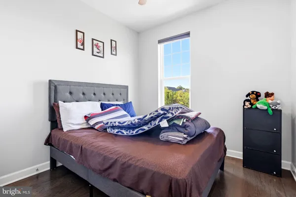 a bedroom with a bed and a dresser