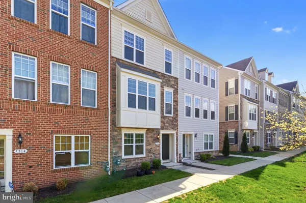 a front view of a building with garden