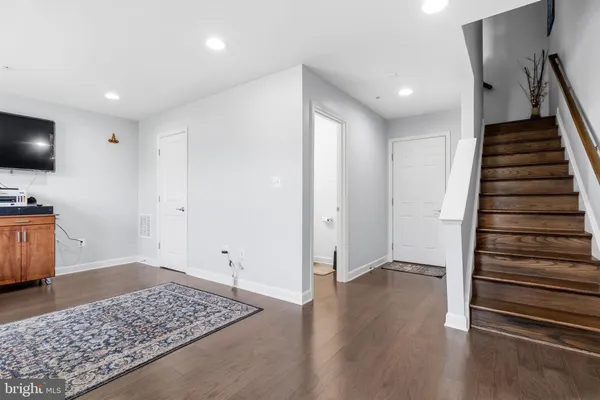 a view of entryway with wooden floor