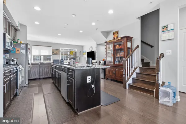 a kitchen with stainless steel appliances a stove and a refrigerator