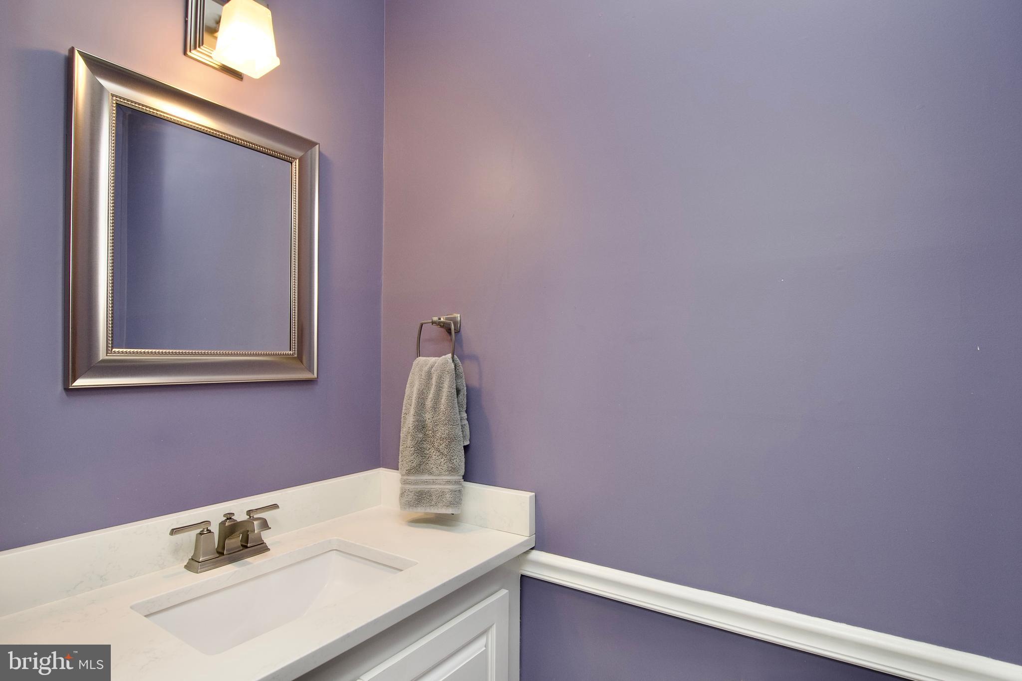 8005 Strauff Road, Unit 17 Towson, MD 21204 - Photo 19 of 49 a bathroom with a sink vanity and a mirror