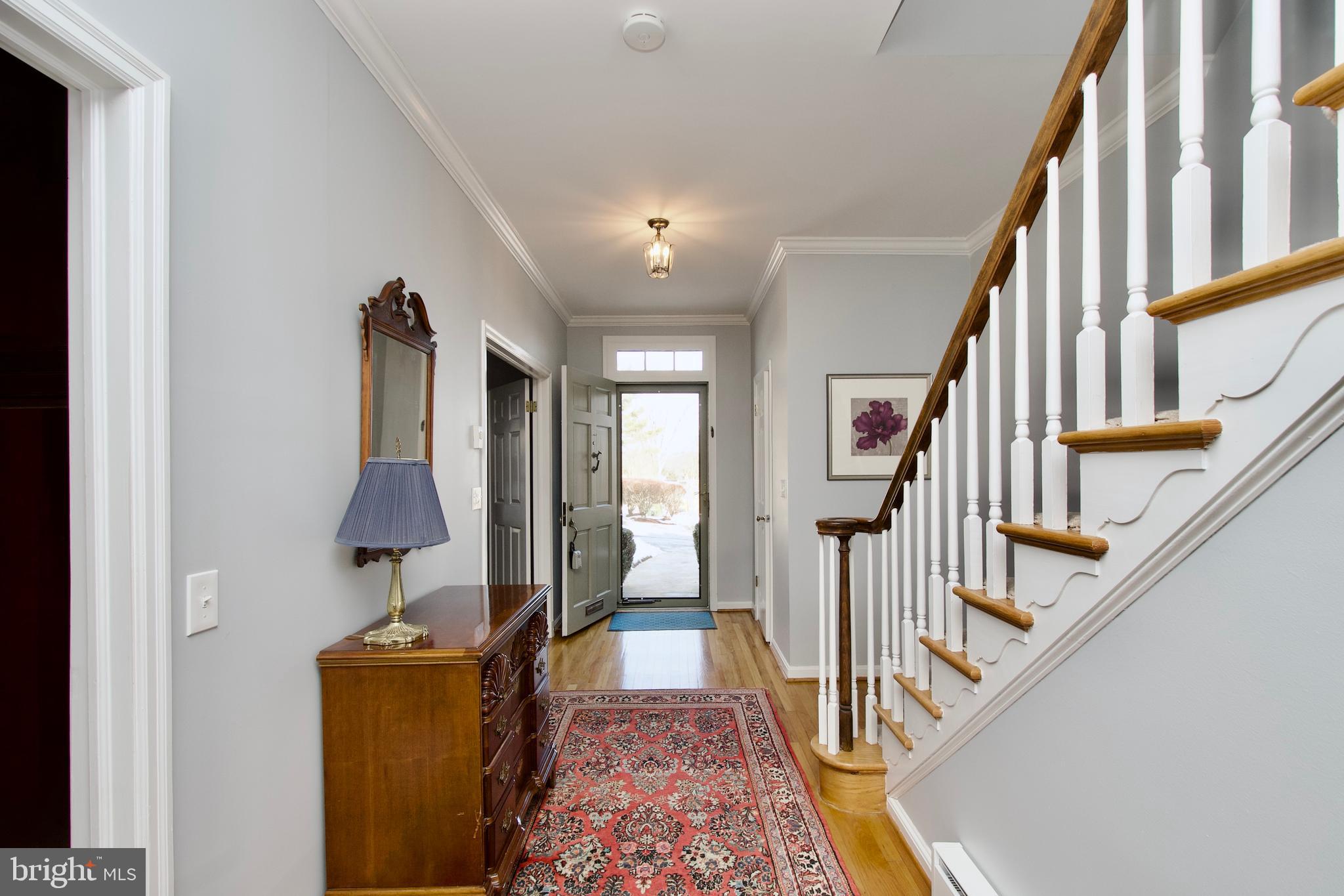 8005 Strauff Road, Unit 17 Towson, MD 21204 - Photo 3 of 49 a view of a hallway with furniture and stairs