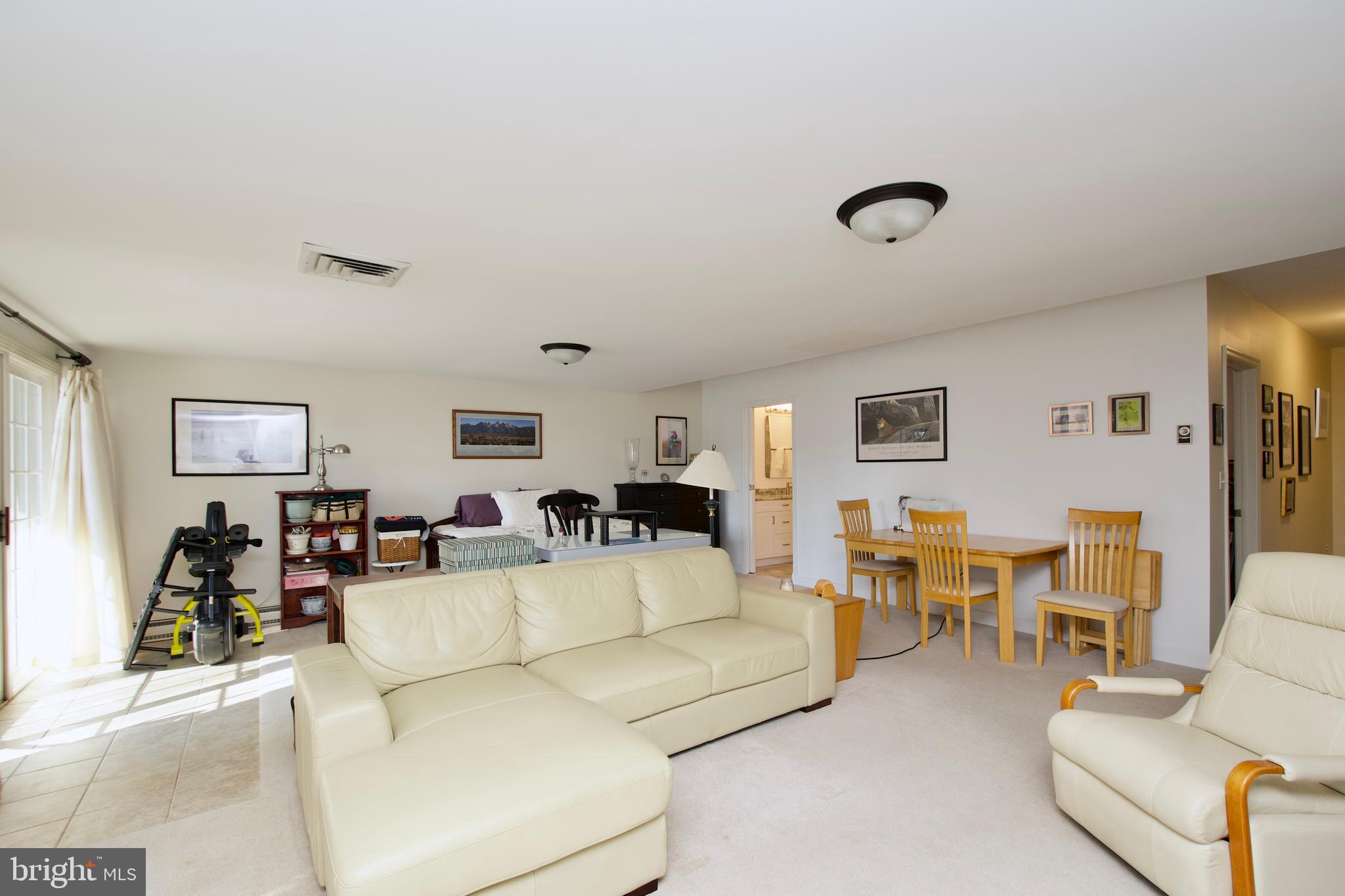 8005 Strauff Road, Unit 17 Towson, MD 21204 - Photo 43 of 49 a living room with furniture and wooden floor