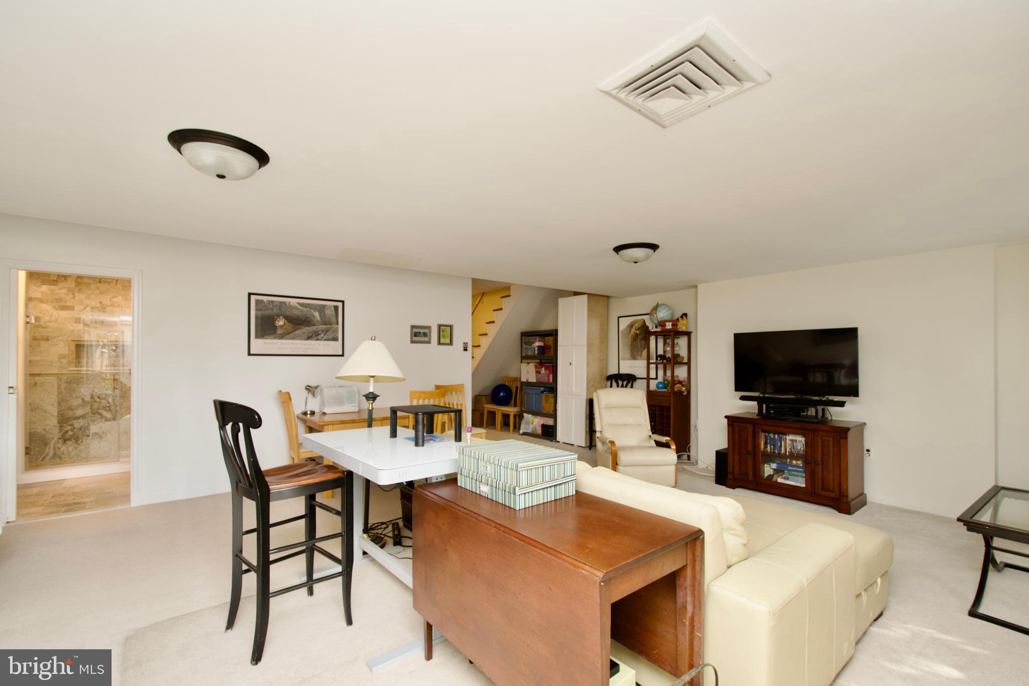 8005 Strauff Road, Unit 17 Towson, MD 21204 - Photo 45 of 49 a living room with furniture and a flat screen tv