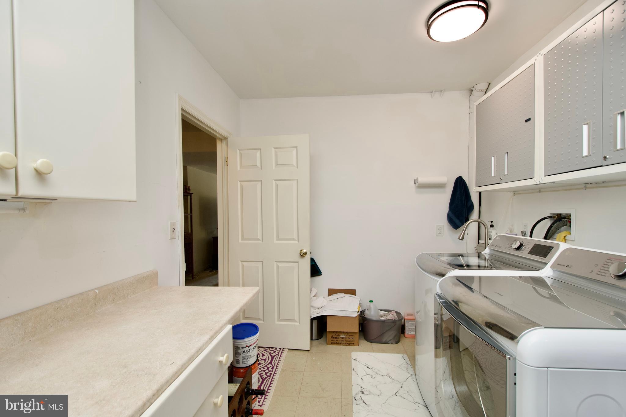 8005 Strauff Road, Unit 17 Towson, MD 21204 - Photo 46 of 49 a kitchen with a sink and a stove top oven