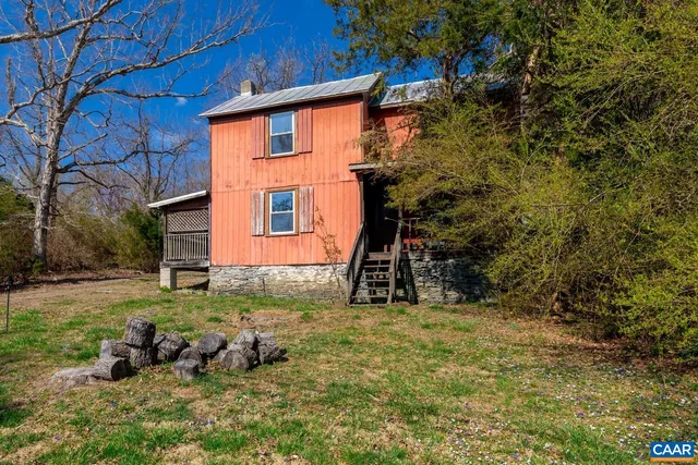 a backyard of a house with lots of green space