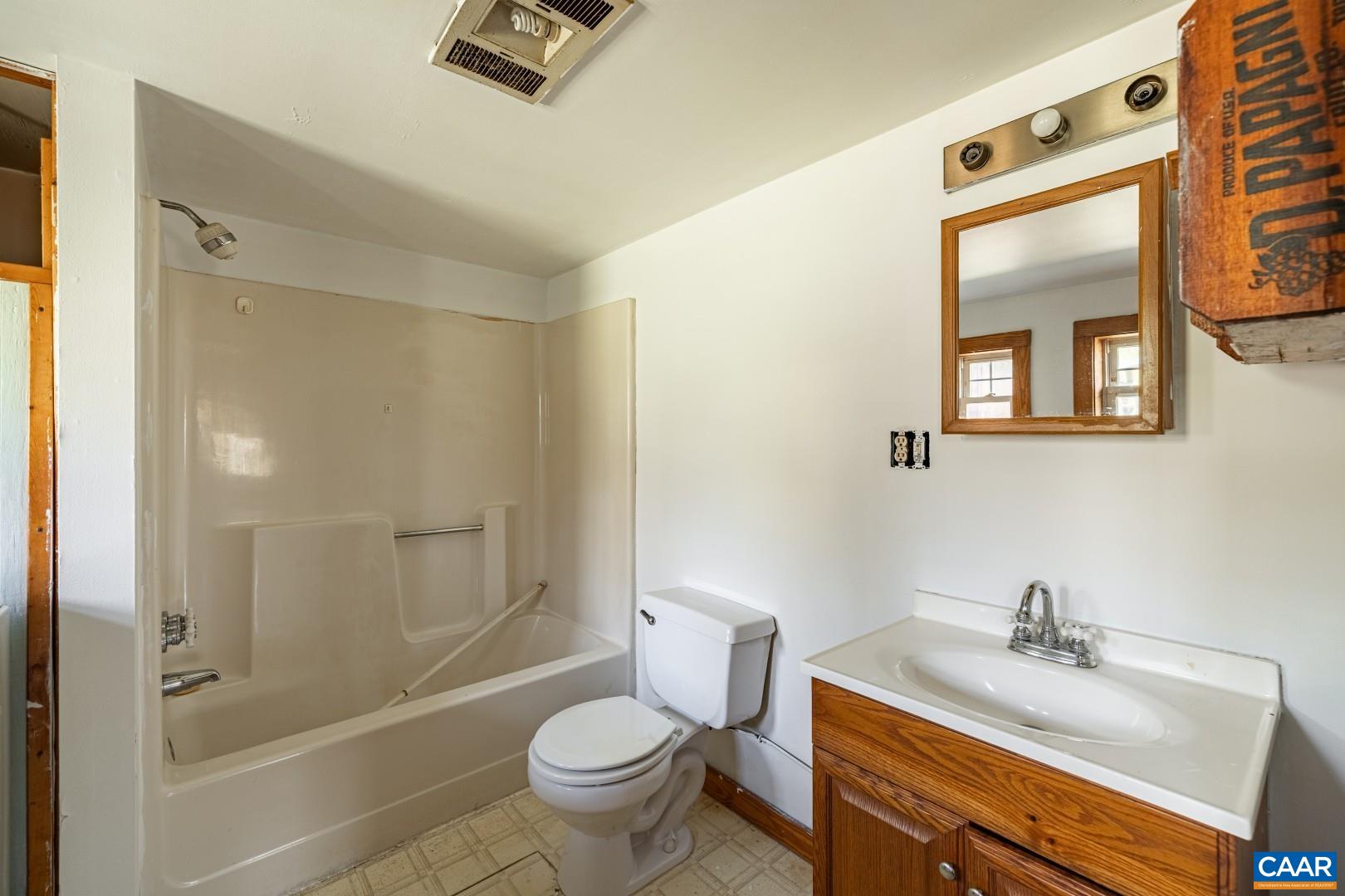 2143 Salem Road Schuyler, VA 22969 - Photo 17 of 36 a bathroom with a sink toilet a mirror and shower