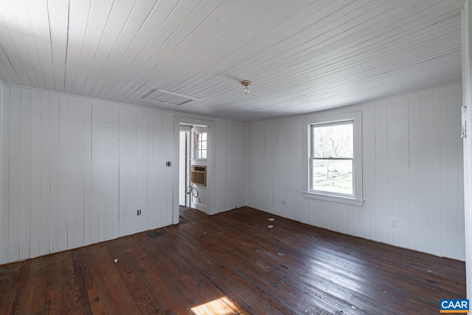2143 Salem Road Schuyler, VA 22969 - Photo 26 of 36 a view of empty room with wooden floor and fan