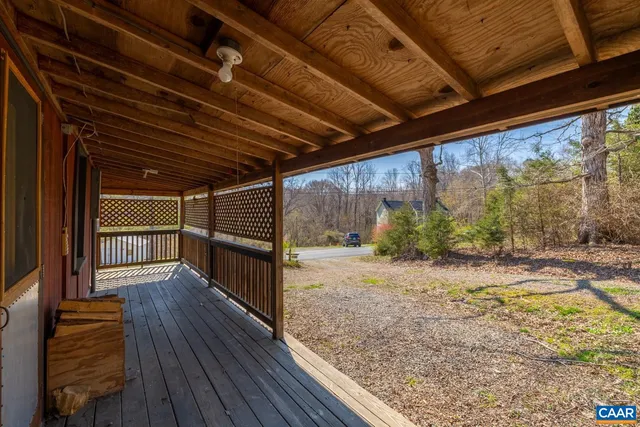 a view of a porch with wooden floor
