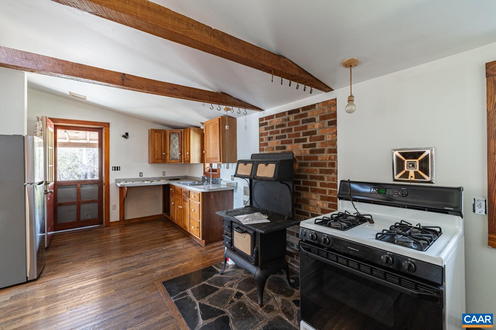 2143 Salem Road Schuyler, VA 22969 - Photo 3 of 36 a kitchen with a stove and a wooden floors
