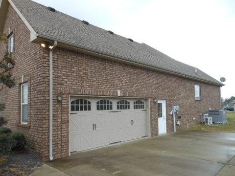 205 Lawrence Lane Springfield, TN 37172 - Photo 3 of 19 a front view of a house with a garage