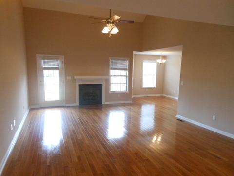 205 Lawrence Lane Springfield, TN 37172 - Photo 4 of 19 a view of empty room with wooden floor and fan