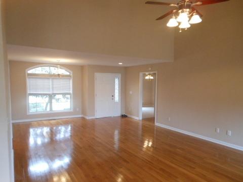 205 Lawrence Lane Springfield, TN 37172 - Photo 5 of 19 a view of an empty room with wooden floor and a window