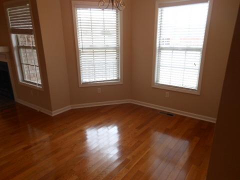 205 Lawrence Lane Springfield, TN 37172 - Photo 6 of 19 a view of an empty room with wooden floor and a window