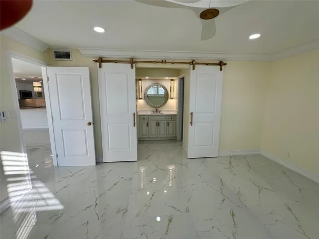 a bathroom with a sink a vanity and a mirror
