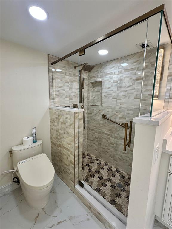 303 North Riverside Drive, Unit 1002 Pompano Beach, FL 33062 - Photo 16 of 27 a bathroom with a toilet and shower