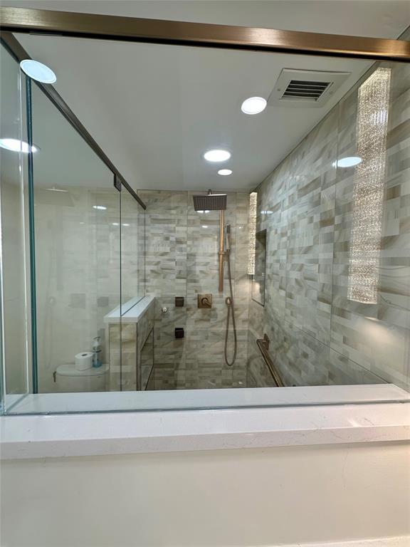 303 North Riverside Drive, Unit 1002 Pompano Beach, FL 33062 - Photo 17 of 27 a bathroom with a shower and a bathtub